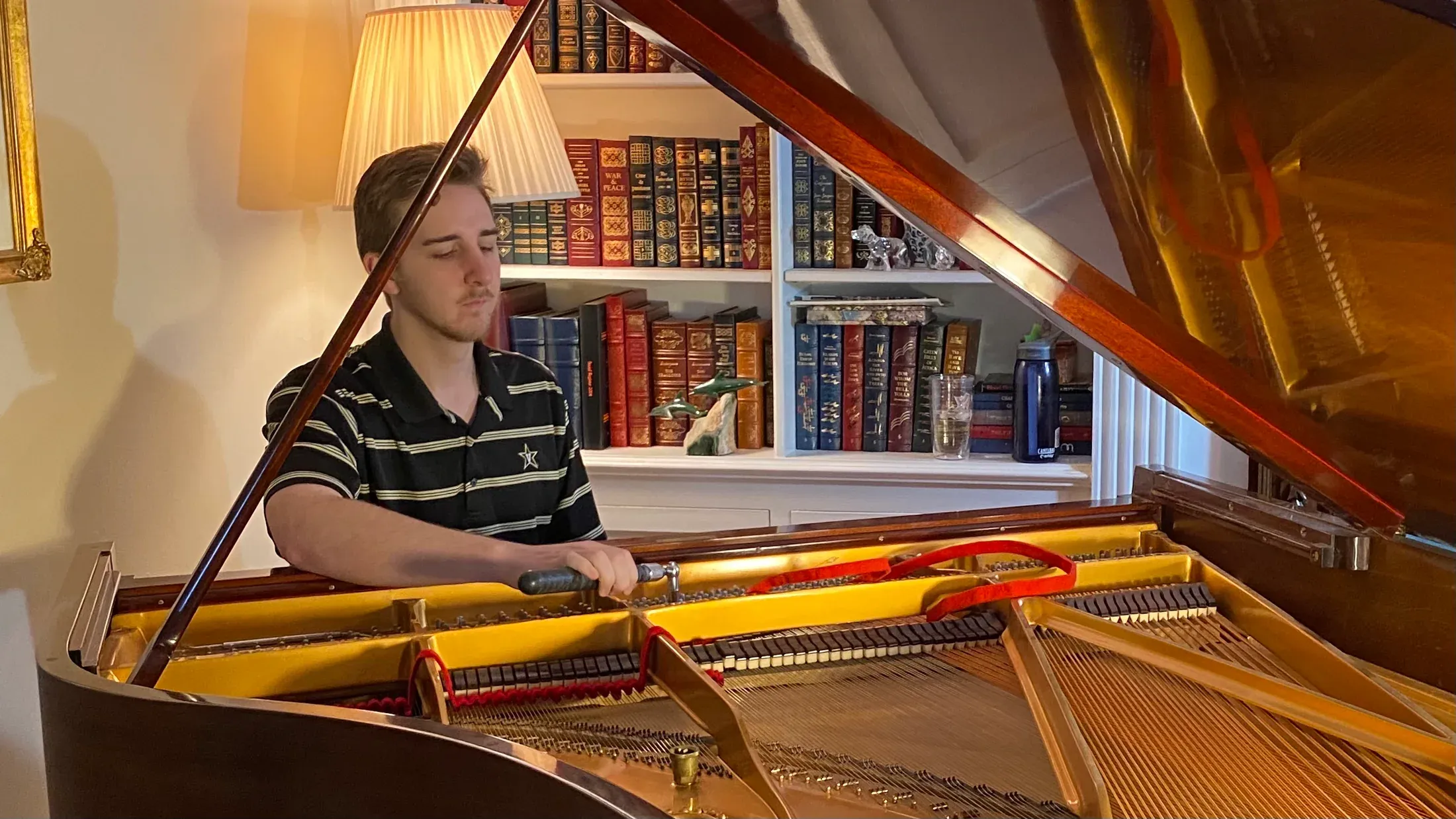 Pierce O’Brien working at a grand piano