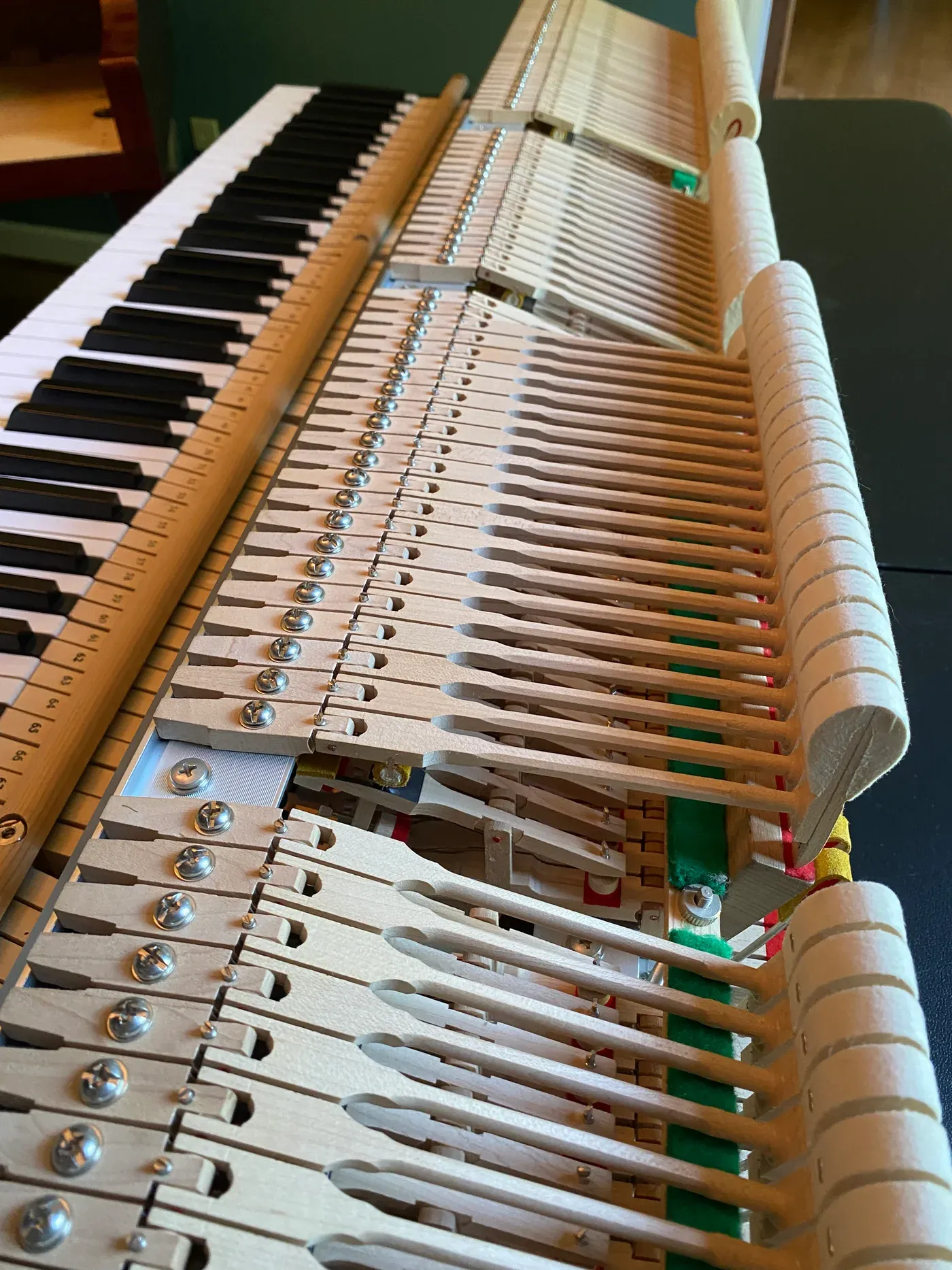 Detailed view of an upright piano action and hammers